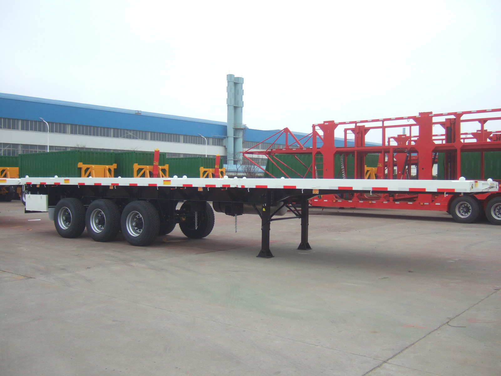 China 40 feet,3 axles,leaf spring suspension,super single tire, Carbon Steel Flat Bed Container Semi-Trailer  9403TJZPDT wholesale