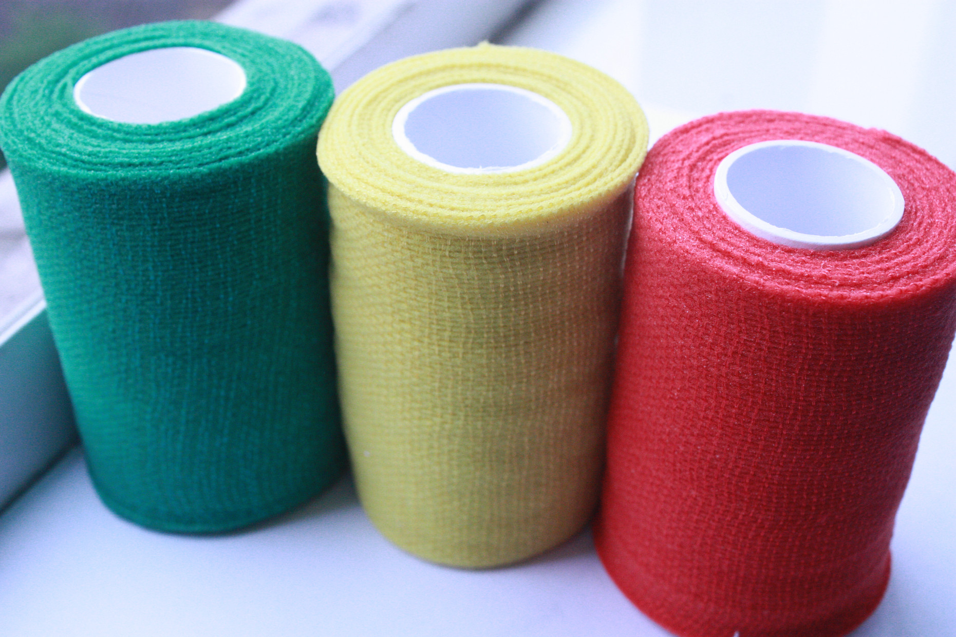 China Red / Yellow / Green Breathable Self - adherent Flexible Cohesive PBT Bandages wholesale