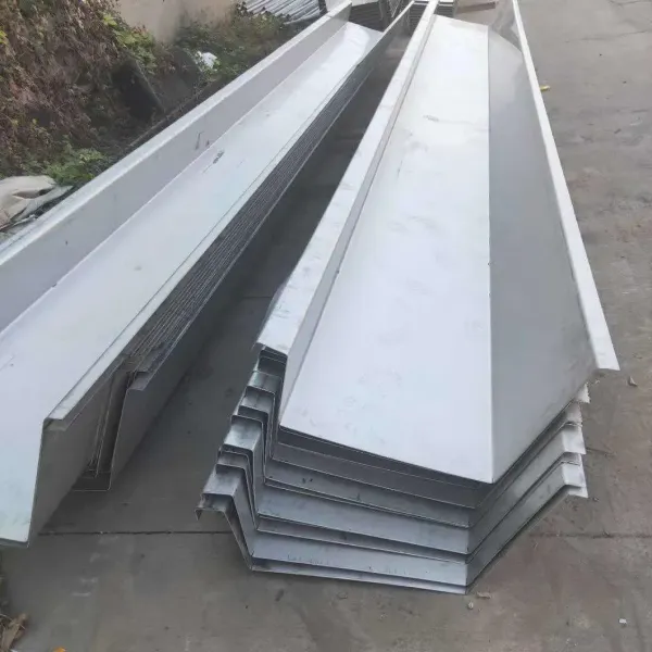 Finished stainless steel gutter system on steel structure