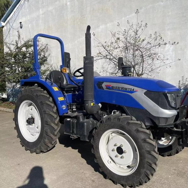 Quality Four Wheel Agricultural Farm Tractor With Front End Loader And Digger Tractor for sale
