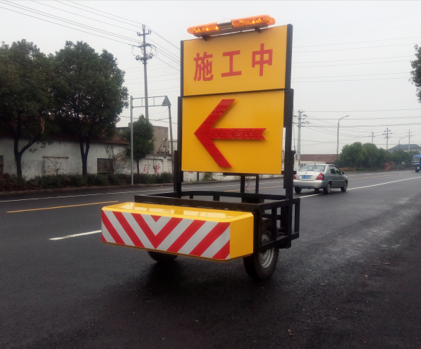 Buzzer aluminum traction type mobile vehicle barrier showing installation on maintenance vehicle